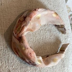 Anthropologie headband. Peach muted soft flower pattern. Very pretty